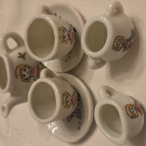 Vintage Minature Tea Set with Girl Walking Dog Illustration